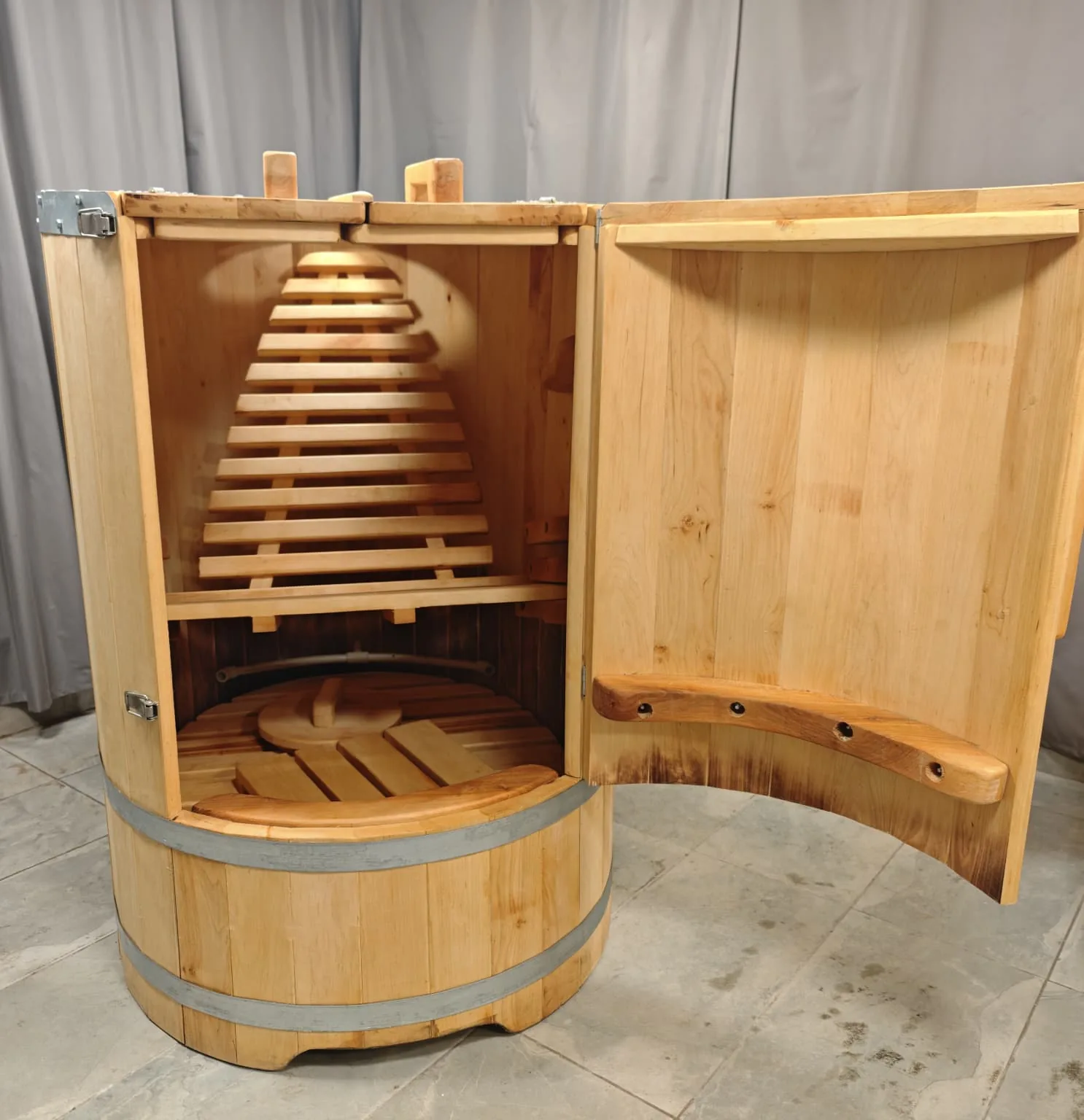 Open Karaliskā Pro-2 steam barrel sauna with an ergonomic bench